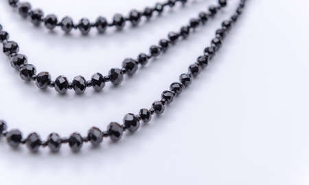 Black stone necklace on white  backgroundの写真素材