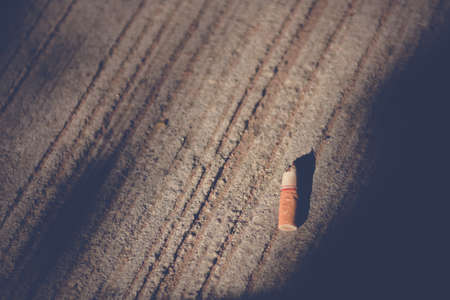Cigarette stub on the floor with sunlight,Quit smoking concept.の写真素材