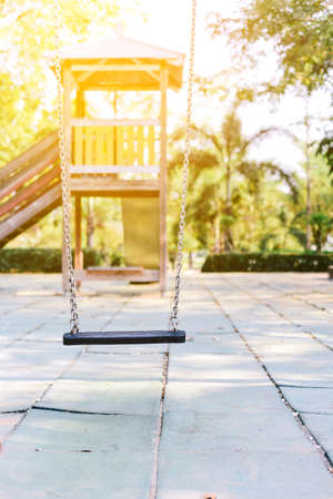 Old wooden Empty swing placed in the garden.の写真素材