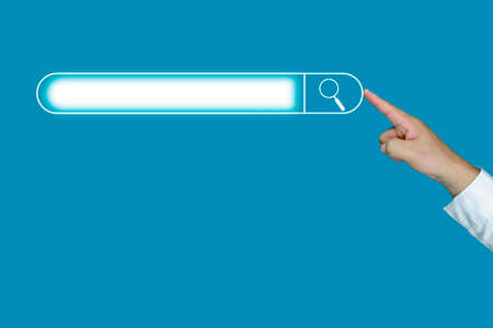 Businessman hand Searching Data with blue background, 

Concept Online networking search and browse Internet information.の写真素材