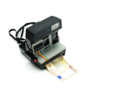 vintage camera producing money sell photos stock photography conceptの写真素材