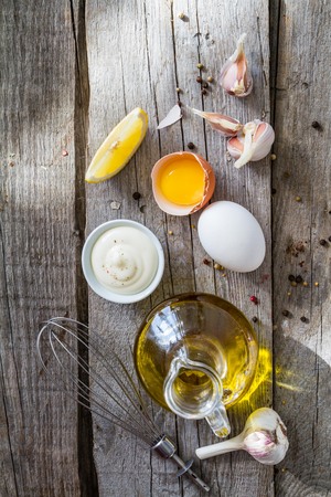 Mayonaise ingredients on rustic wood backgound, copy spaceの写真素材