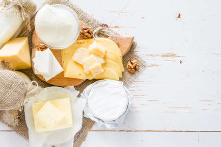 Selection of milk and dairy products on white wood backgroundの写真素材