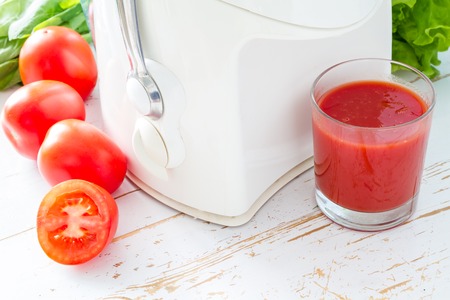 Selection of vegetables and juice, white wood backgroundの写真素材