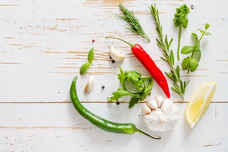 Selection of herbs and spices, white wood background, copy space, top viewの写真素材