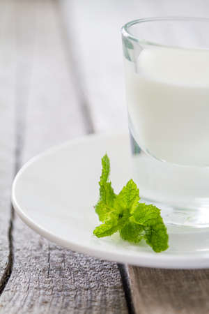 Mint leaf on rustic wood background, closeupの写真素材