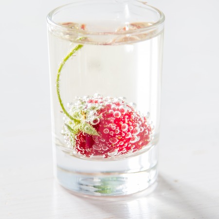 Strawberry lemonade ingredients with mint, white wood background, closeupの写真素材