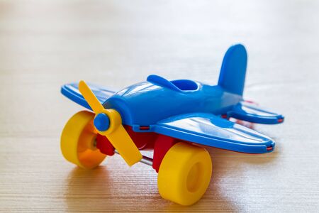 Airplane on wood background with copy spaceの写真素材
