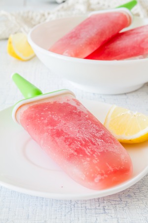 Fruit juice ice pops, white wood backgroundの写真素材