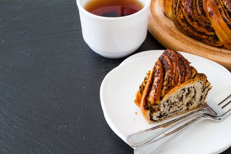 Ring roll with poppy on dark stone  backgroundの写真素材