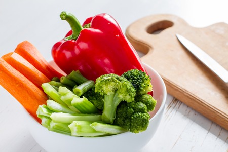 Preparing vegetable sticks on white wood backgroundの写真素材