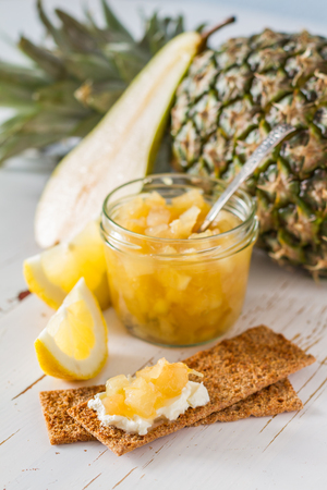 Pear and lemon jam and ingredients, white wood backgroundの写真素材