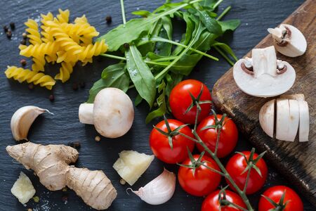 italian background with mushrooms and tomatoes, top viewの写真素材