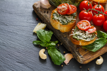 Toasts with pesto sause and tomatoes, closeupの写真素材