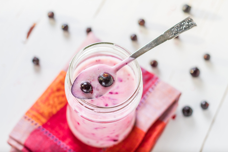 strawberry and banana smoothie, glass jar, white wood backgroundの写真素材