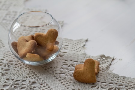 Heart shaped cookies in glass bowl, copy spaceの写真素材