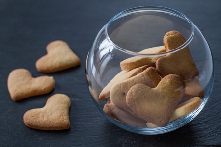 Heart shaped cookies in glass bowl, copy spaceの写真素材