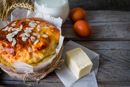 Easter bread and ingredients on rustic wood background, copy spaceの写真素材