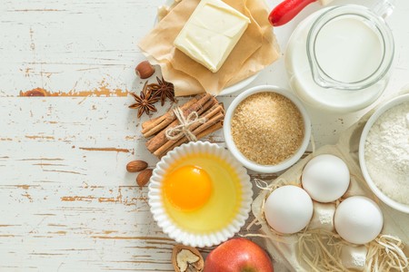 Baking ingredients on rustic background, top view