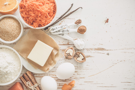 Ingredients for baking carrot cake, wood background tonedの写真素材