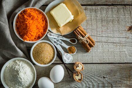 Ingredients for baking carrot cake, wood backgroundの写真素材