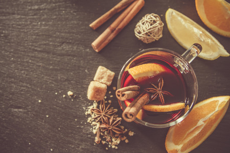 Mulled wine ingredients on dark stone background, top view, tonedの写真素材