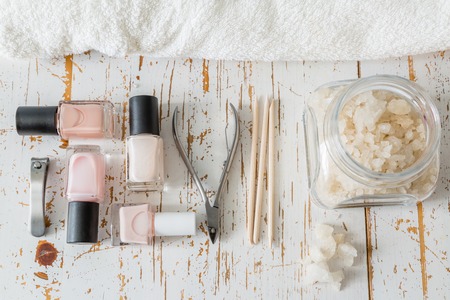 Selection of manicure tools on white wood background, copy spaceの写真素材