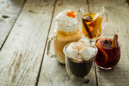 Selection of autumn drinks on wood background, copy spaceの写真素材