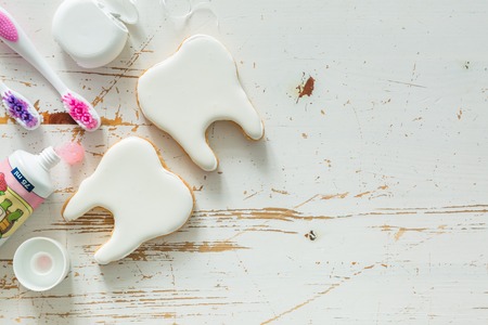 Teeth shaped cookies background with copy space