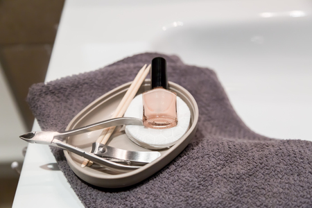 Selection of manicuew accessories in bathroom, towel, copy spaceの写真素材