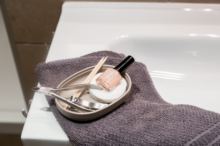 Selection of manicuew accessories in bathroom, towel, copy spaceの写真素材