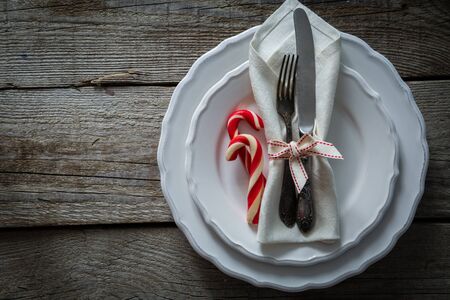 Christmas table setting decoration, copy space, wood backgroundの写真素材