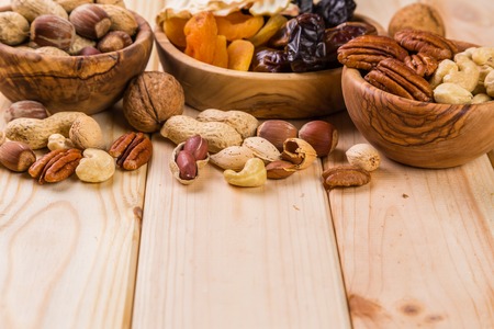 Selection of dried fruits and nuts as symbols of Tu Bishvat, copy space