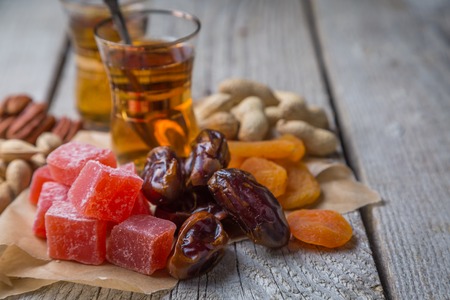 Turkish sweets, nuts and dried fruits, tea, copy spaceの写真素材