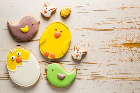 Easter cookies on white wood background, copy space