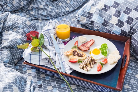 Valentines day breakfast - bacon, egg, pancake, bananaの写真素材