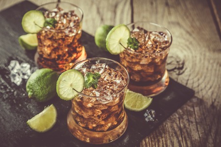 Rum and cola cocktail in glassesの写真素材