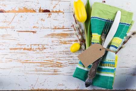 Easter table setting with fluffy willow and tulipsの写真素材