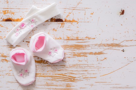 Baby shower concept - child essencials on wood background