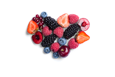 Heart shaped raspberries on white backgroundの写真素材