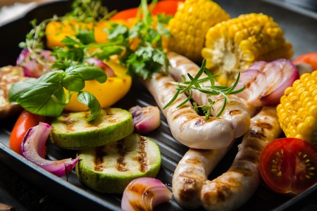 Barbeque sausages with vegetablesの写真素材