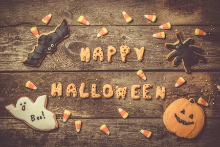 Halloween concept with cookies and candies, rustic wood backgroundの写真素材