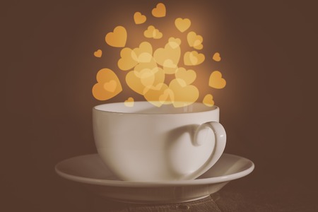 Valentines day concept - cup with heart shaped bokeh backgroundの写真素材