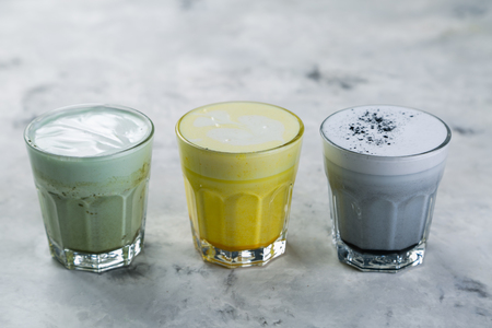 Selection of colorful super lattes on marble backgroundの写真素材