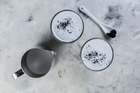 Food trend - charcoal latte on marble backgroundの写真素材