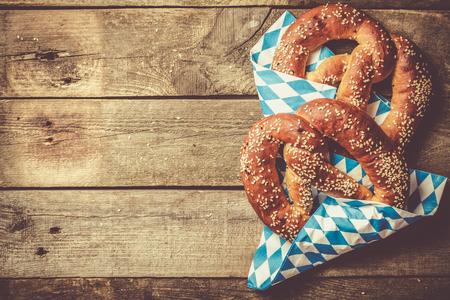 Oktoberfest concept - pretzels on rustic wood backgroundの写真素材