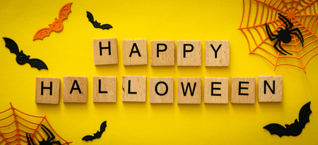 Halloween concept - spiders, bats, web paper crafts on bright backgroundの写真素材