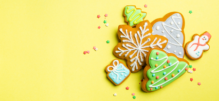 Christmas cookies on bright yellow backgroundの写真素材