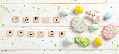 Easter background - cookies shaped like eggs, flowers, bunnies