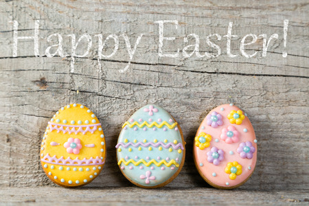 Easter concept - cookies on wood background